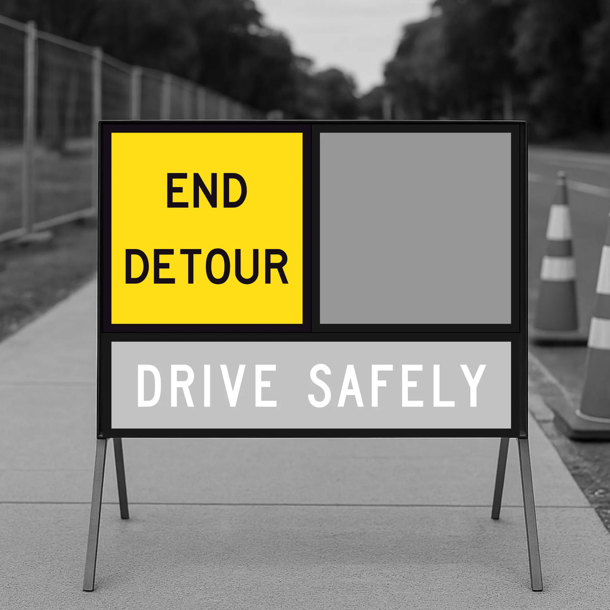 Detour sign with 'End Detour' and 'Drive Safely' text on a road.