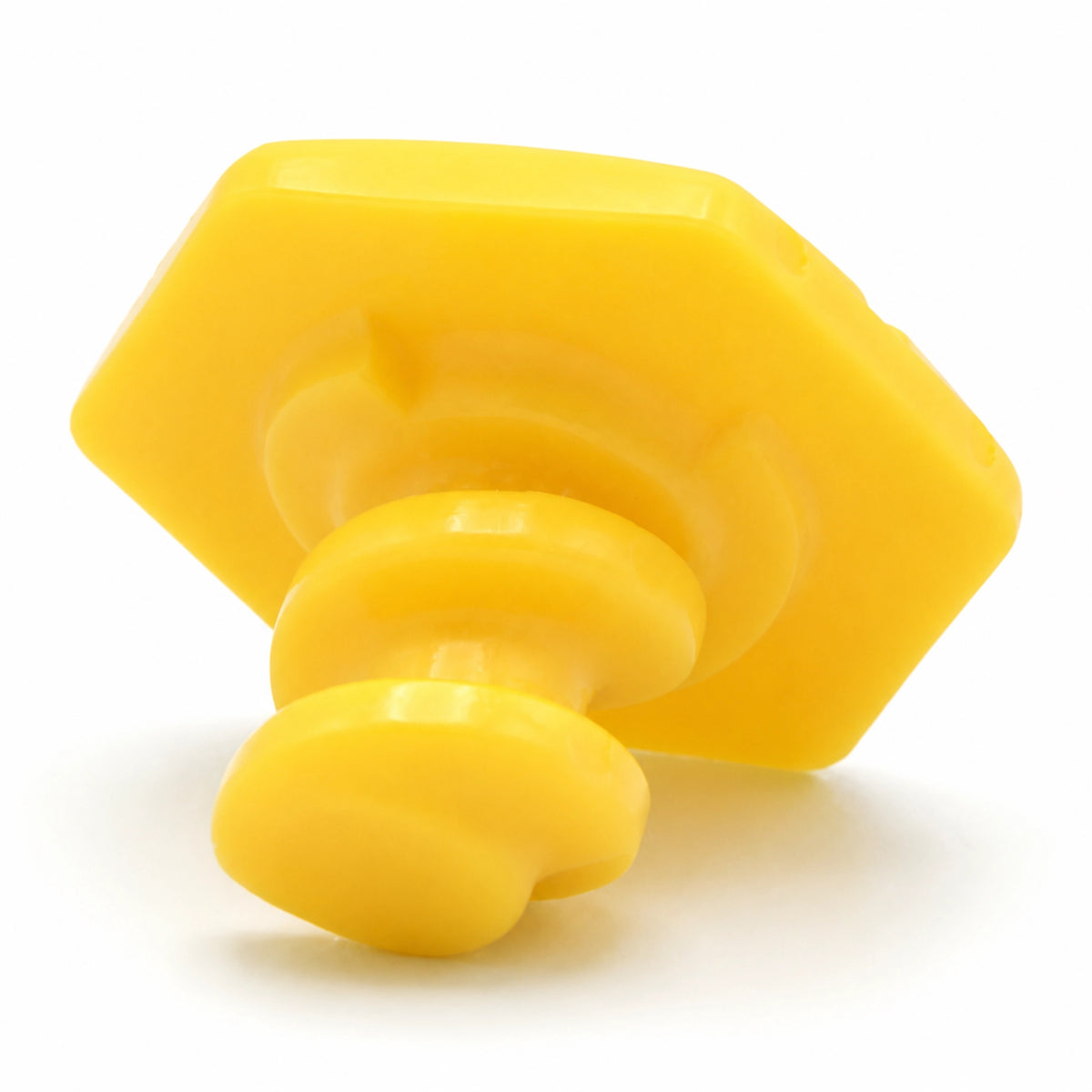 Close up of the yellow SupaGrip SafeKerb connector cap showing the hexagonal head and the threaded stem that screws into the base