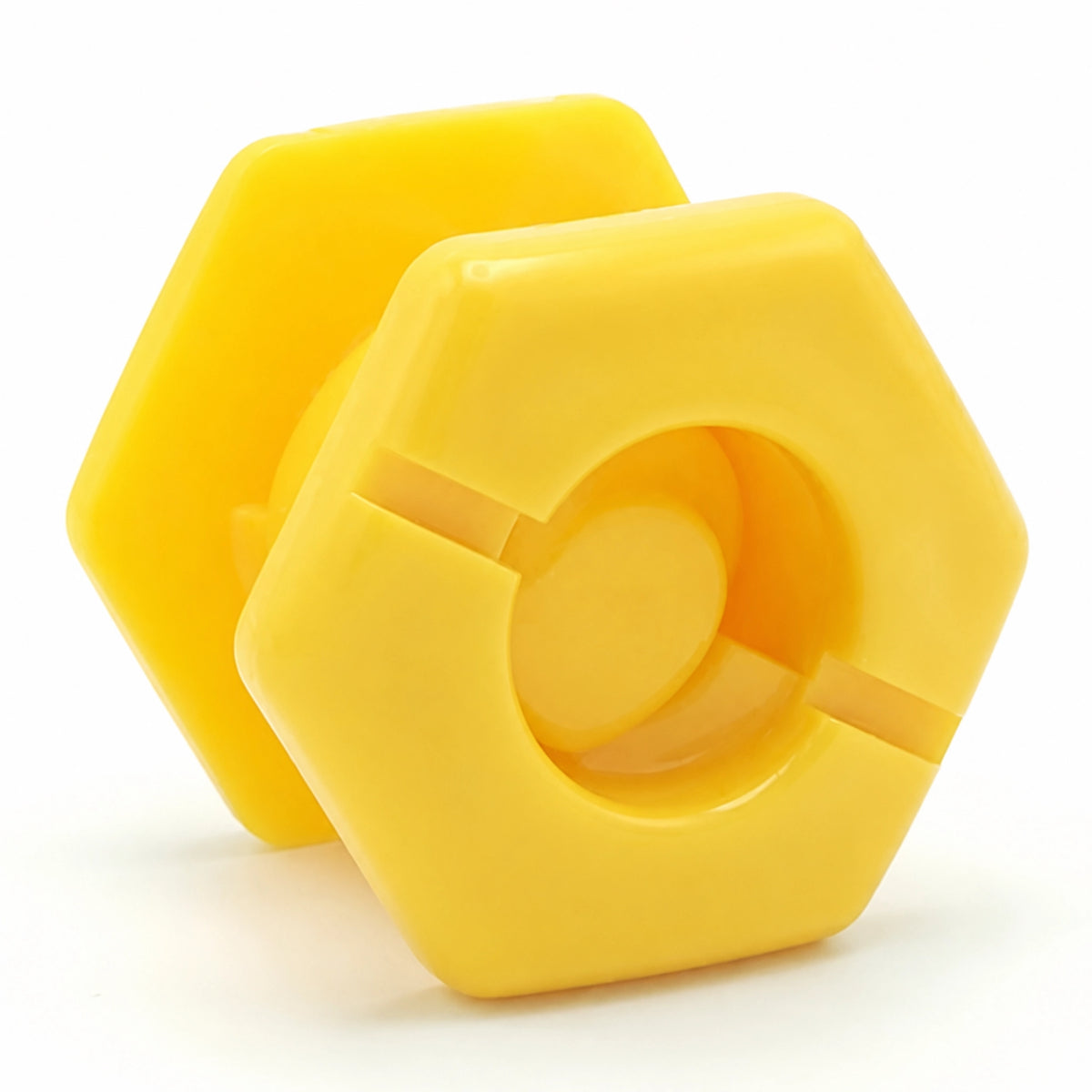Two yellow hexagonal SupaGrip SafeKerb connector components, the front one showing the slotted socket opening