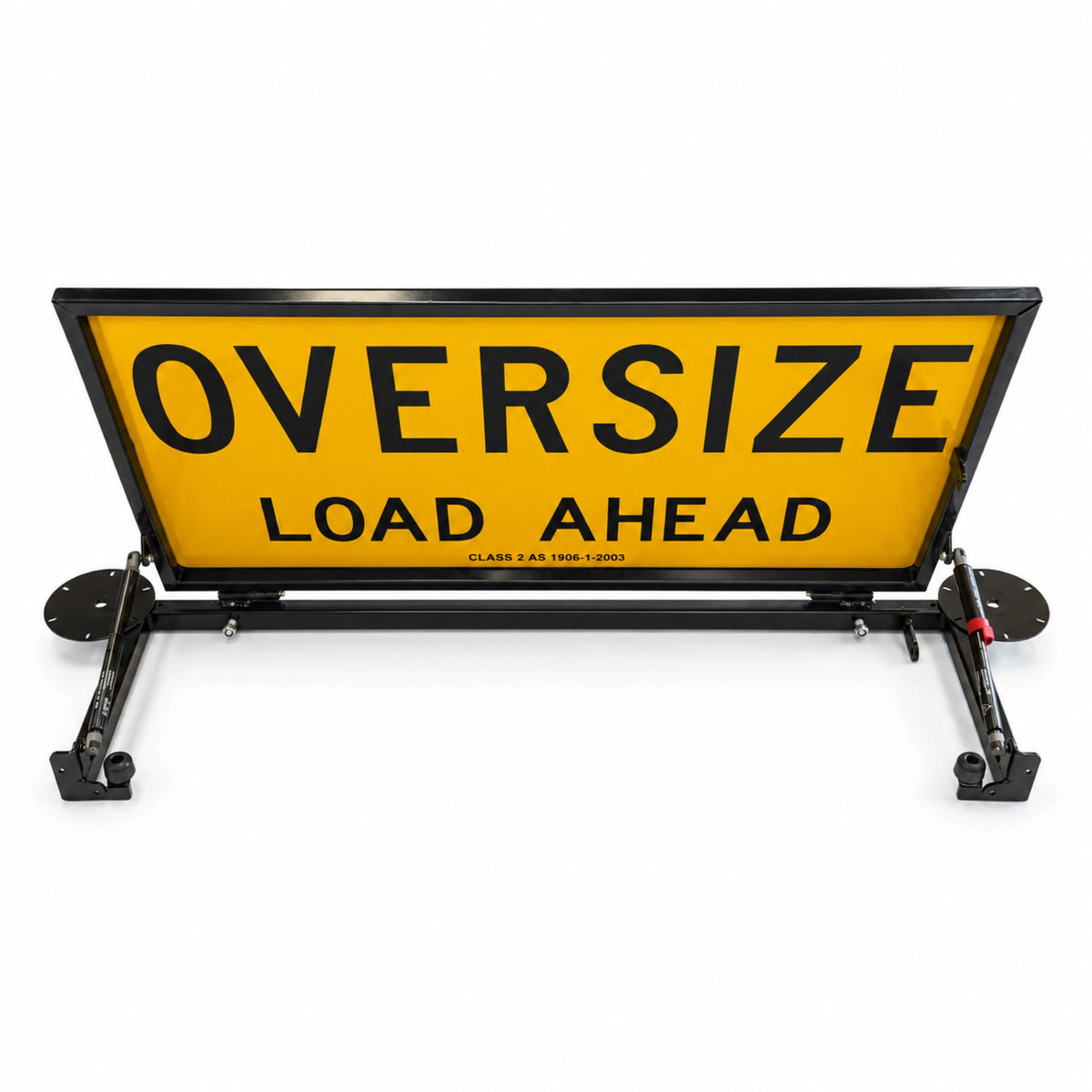 Rear view of the raised double-sided Oversize Load Ahead sign showing the base frame and gas struts