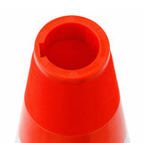 Close-up of a red traffic cone on a white background