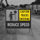 Traffic control message on construction set caution trucks entering