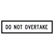 Do Not Overtake GM9-90B 1200x300mm corflute sign panel with black uppercase legend and border on white reflective background