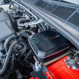 Car battery charger installed in a vehicle's engine compartment