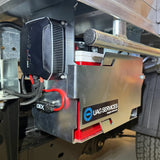 Close-up of a DC to DC Charger with 'UAG Services' branding on a vehicle.