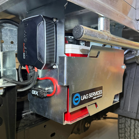 Close-up of a DC to DC Charger with 'UAG Services' branding on a vehicle.