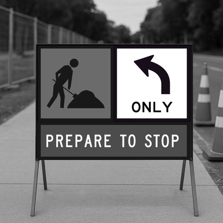 Construction sign with an arrow and text on a road