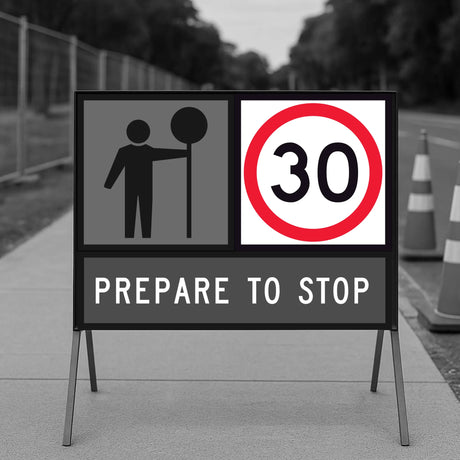 temporary traffic road sign indicating a speed limit of 30 on a sidewalk.