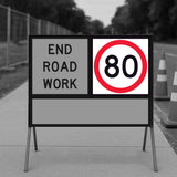 temporary traffic roadwork sign indicating 'End Road Work' with a speed limit sign showing '80'.
