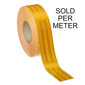 Roll of yellow Class 1 reflective tape on a cardboard core with a length unrolled showing the diamond pattern face, labelled sold per meter