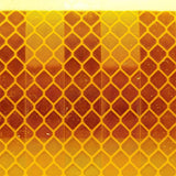 Close-up of the diamond pattern retroreflective surface of yellow Class 1 tape