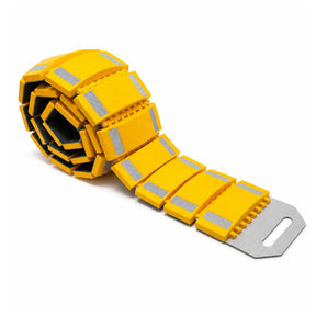 Yellow portable rollout speed bump partly unrolled showing linked modules with reflective strips and metal end plate