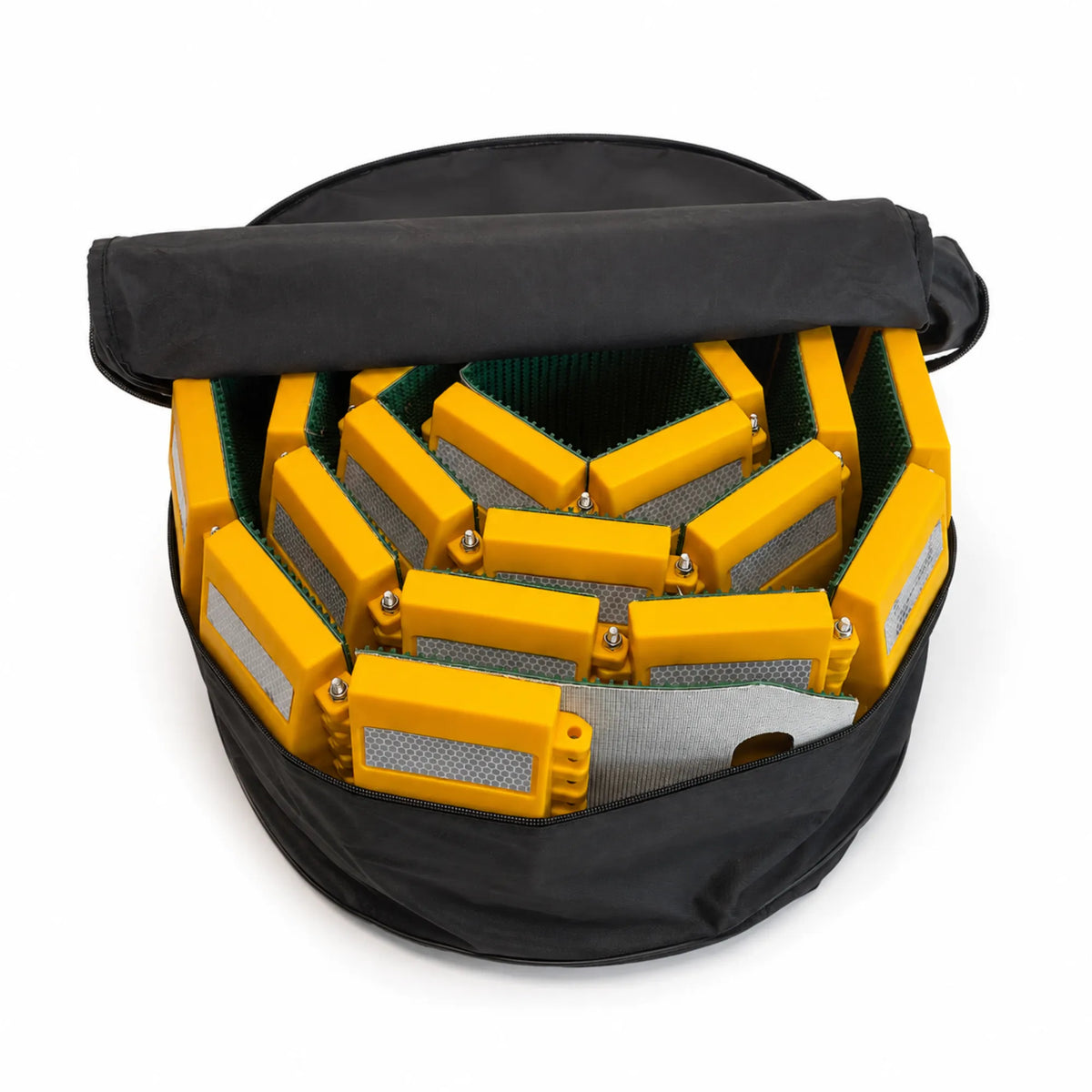 Rolled speed bump packed inside the included black carry bag with the lid open