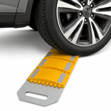 Vehicle tyre crossing the yellow rollout speed bump laid across the road surface