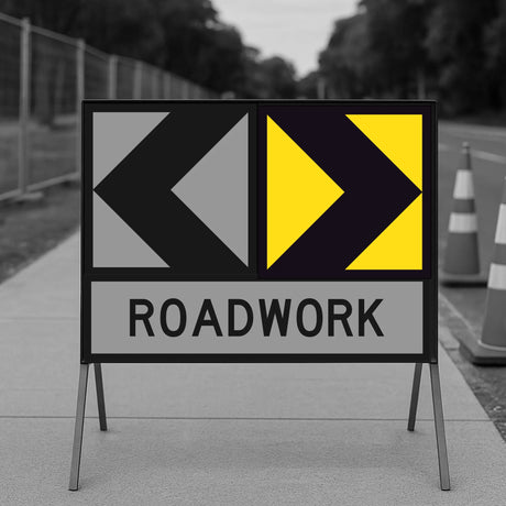 Roadwork Sign with lateral shift marker on sidewalk with cones