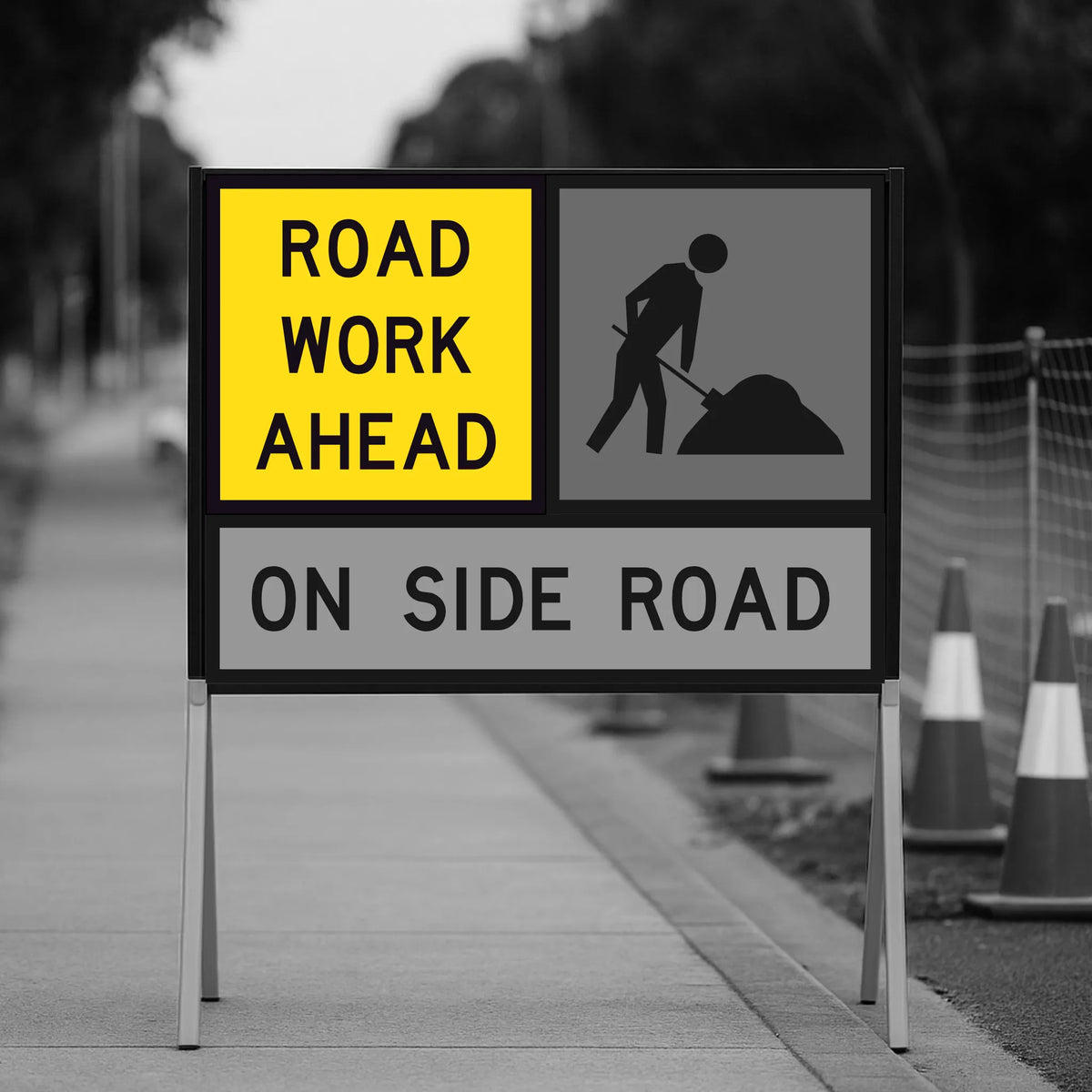 Temporary Traffic Control Road work ahead sign on a blurred background of a sidewalk and road.