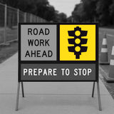 Road work ahead multi message sign with traffic light symbol on a gray background