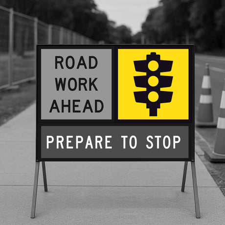 Road work ahead multi message sign with traffic light symbol on a gray background