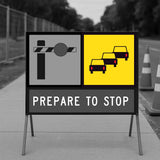 Road sign with traffic symbols and 'Prepare to Stop' text on a road background