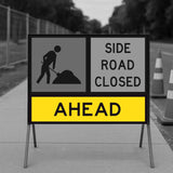 Temporary Traffic Control Road closure sign indicating 'Side Road Closed Ahead' with a black and yellow design.