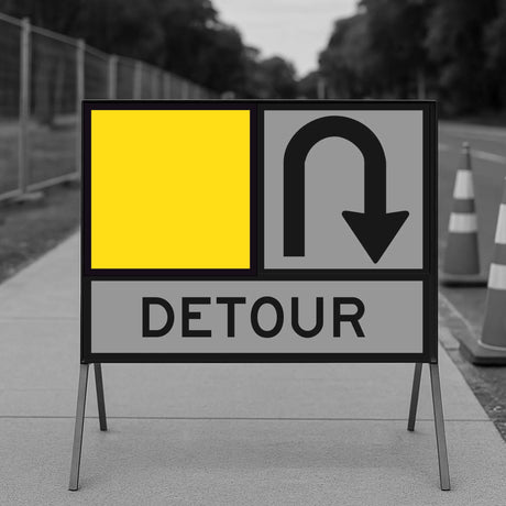 Detour sign with yellow blank square and black arrow on a gray background