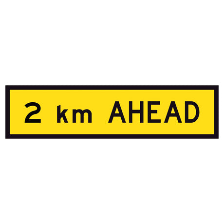 2 km Ahead TM1-36B 1200x300mm corflute sign panel with black 2 km AHEAD text and border on yellow retroreflective background