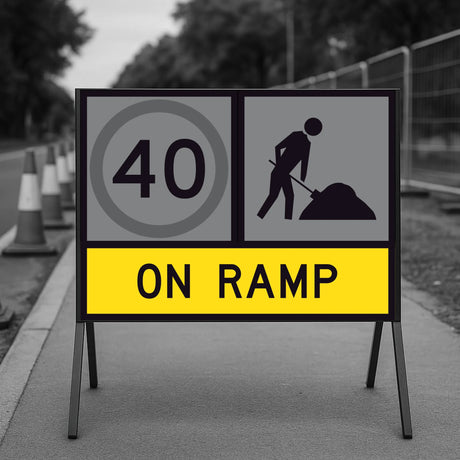 Temporary traffic Roadwork sign indicating a speed limit of 40 on a ramp with traffic cones in the background.