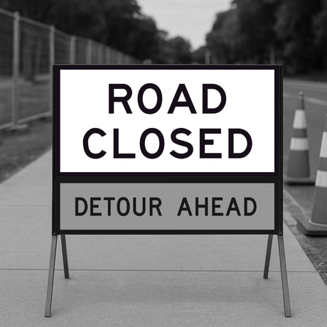 Road closed sign with roadwork information on a blurred background