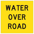 Water Over Road TM3-21A 600x600mm corflute sign panel with black WATER OVER ROAD text and border on yellow retroreflective background