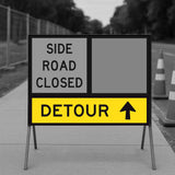 Detour sign indicating 'Side Road Closed' with an arrow pointing upwards.