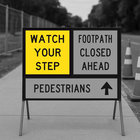Warning sign on a sidewalk with text 'Watch your step', 'Footpath closed ahead', and 'Pedestrians'.