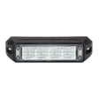 Front view of the black surface mount LED warning light head, four clear reflector cells behind the lens with a screw fixing lug at each end