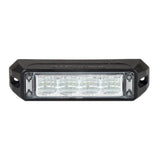 Front view of the black surface mount LED warning light head, four clear reflector cells behind the lens with a screw fixing lug at each end