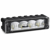 The C4 warning light head with the black plastic surround removed, showing the bare module, its ribbed backing and the four LEDs behind the clear lens cover