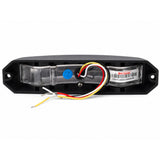 Rear view of the LED warning light head showing the mounting holes at each end, the factory barcode label and the four core wiring loom in black, white, red and yellow