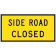 Side Road Closed TM1-32C 1200x600mm corflute sign panel, black SIDE ROAD CLOSED legend over two lines on yellow retroreflective background with black border