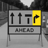 Temporary Traffic Control Road sign with lane status arrows and 'AHEAD' text on a blurred background