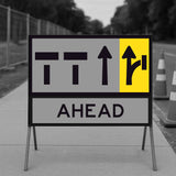 Road sign with traffic direction symbols on a gray background