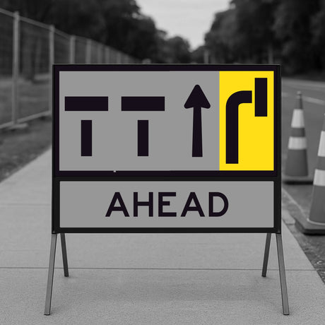 lane status road sign with traffic symbols and 'AHEAD' text on a gray background