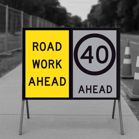 Temporary traffic Roadwork ahead sign with speed limit indication on a stand.