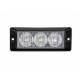Front view of the black surface mount LED warning light head, three clear TIR optical cells behind a flush lens with a screw fixing hole in each end flange