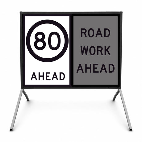 Temporary traffic control road sign with speed limit 80 ahead and 'Road Work Ahead' message on a stand.