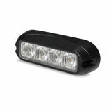 Front view of the black surface mount LED warning light head with four clear TIR lens cells and two screw mounting ears