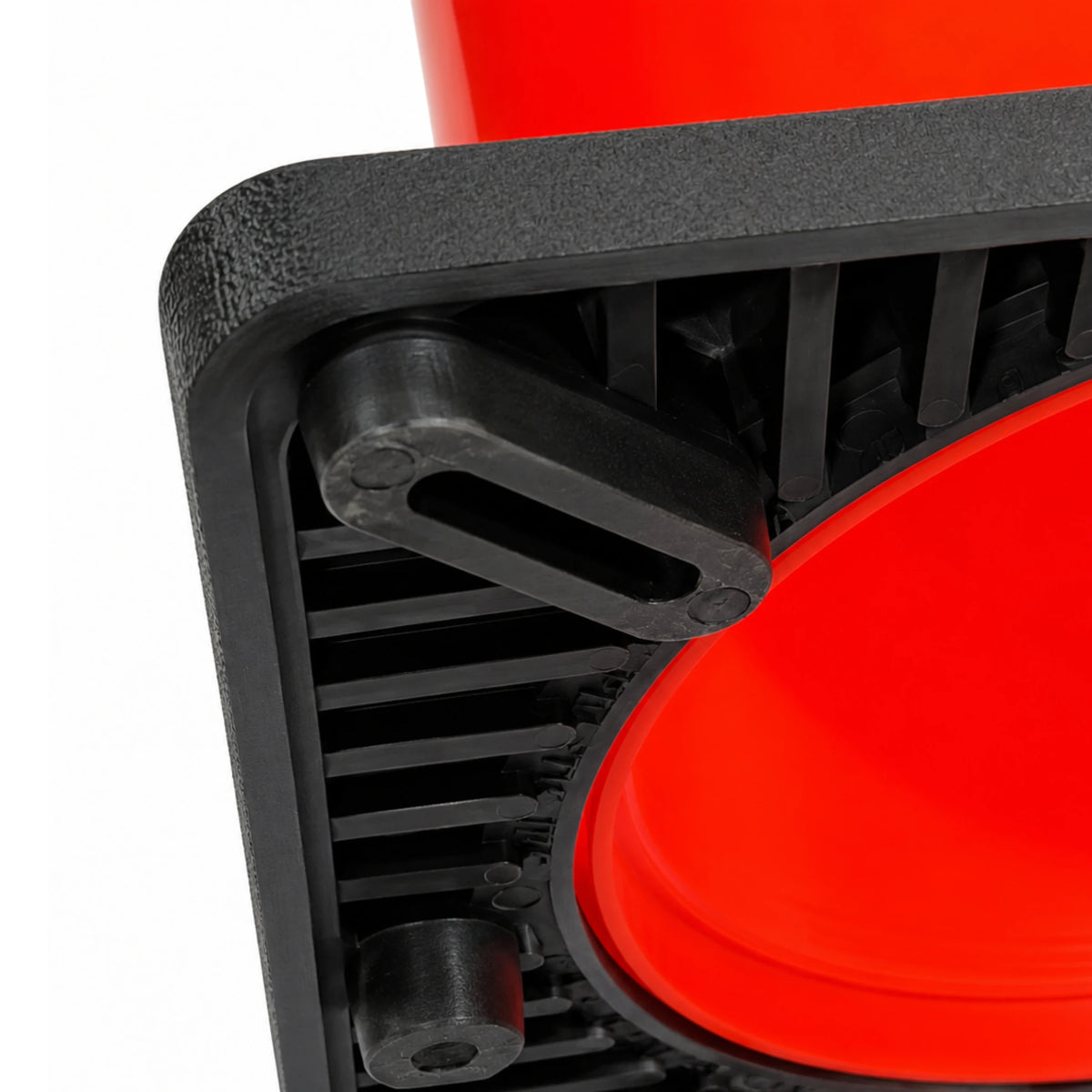 Angled underside view of the cone base showing ribbed black PVC construction and rubber foot pad