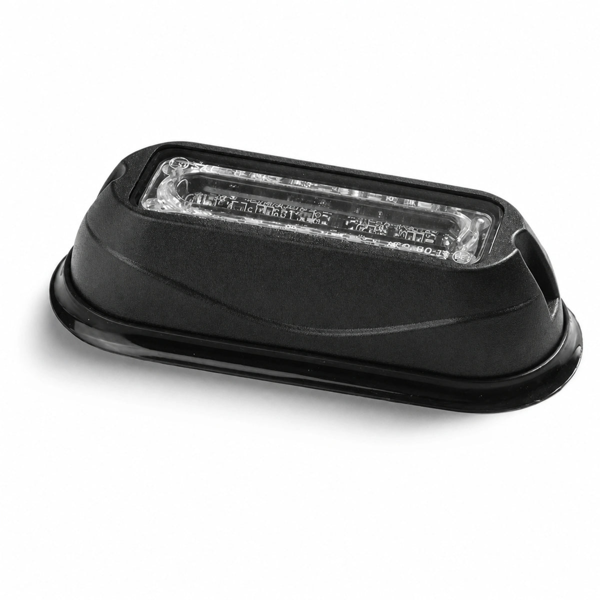 Angled view of the black LED warning light head showing the raised housing, recessed clear linear lens and moulded rubber base surround