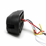 End view of the LED warning light head showing the four core wiring loom in red, black, white and yellow leaving the rear of the housing
