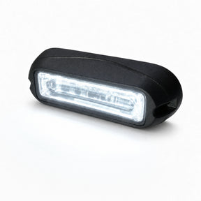 The LED warning light head running white output across the full length of the linear lens