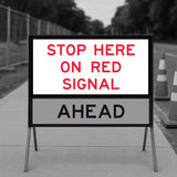 Stop Here On Red Signal RM6-6C corflute panel displayed at a temporary traffic signal stopping point
