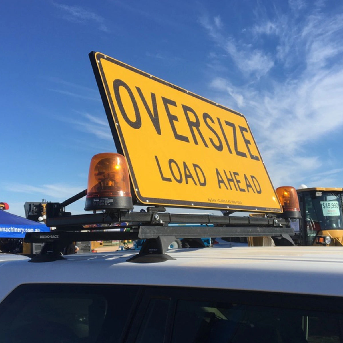 Oversize Load Ahead sign mounted on a ute roof rack with amber beacons fitted either side