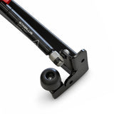 Close-up of the gas strut and rubber stop at the end of the sign base frame